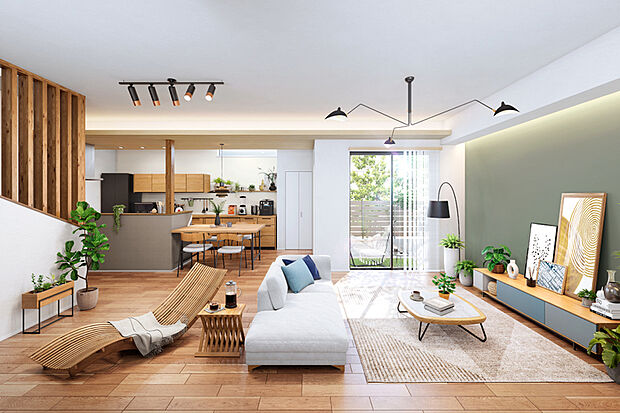 【庭の緑を採り込む22帖LDKのある家】
みんなが集まるLDKは、ゆったりとくつろげる22帖の広さを確保しました。プライベートガーデンに面した窓から植栽の緑を室内に採り込み、心地よい広がりを感じる設計としています。※1号棟LDK完成予想図