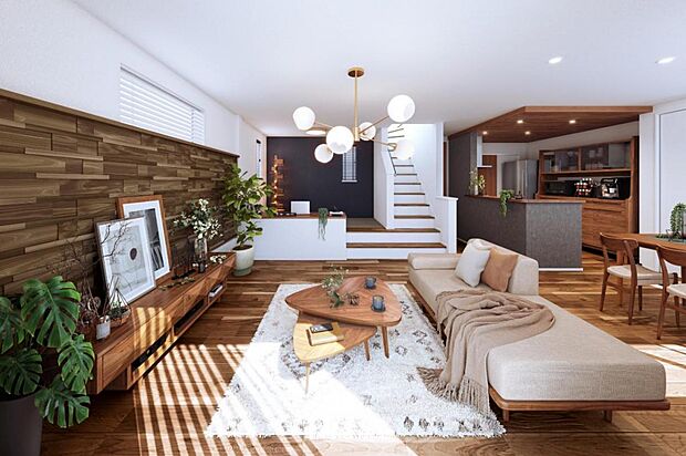 2号棟内観完成予想図|木のぬくもりを肌で感じられるような天然木の突板床材をはじめ、リビングの一部に国産天然杉、ウォールナット、ホワイトアッシュ等の銘木を組み合わせた「芳香・陰影」が特徴の木製パネル「きらめき」を設えました。