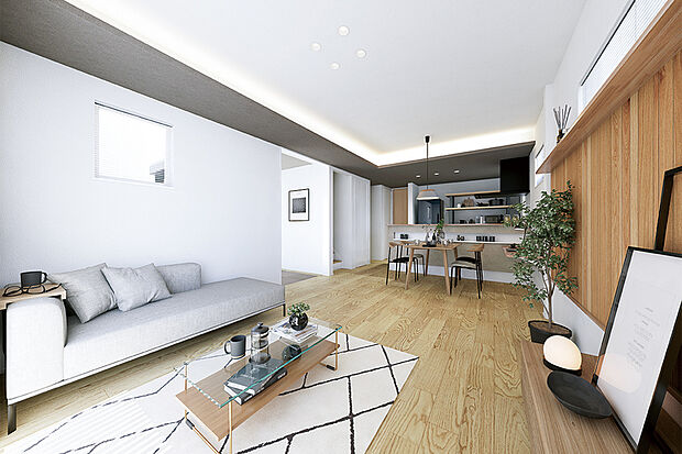 【ホテルライクな住空間】
本物の木を使用したウッドパネルや間接照明を採用したLDK。グレーのアクセントクロスが空間を引き締め、モダンな印象を与えています。※号棟により採用状況が異なります。