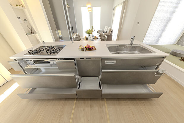 【9号地モデルハウス】【キッチン】
食器洗乾燥機や3口ガスコンロ、グリルを搭載した、使い勝手の良いシステムキッチンです。収納はスライド式の引き出しなので、大型の鍋類など奥に収納したものが取り出しやすい仕様です。