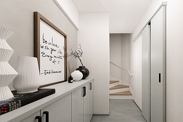 白を基調とした玄関スペース。家族分の靴もすっきりと収めることができます。/1号地完成予想パース