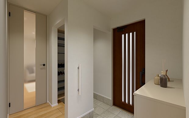 【No.5　玄関】玄関からホールへ直接上がれる「通り抜け可能」なシューズクロークを採用。家族専用の裏動線として活用することで、メインの玄関は常にスッキリと保てます。