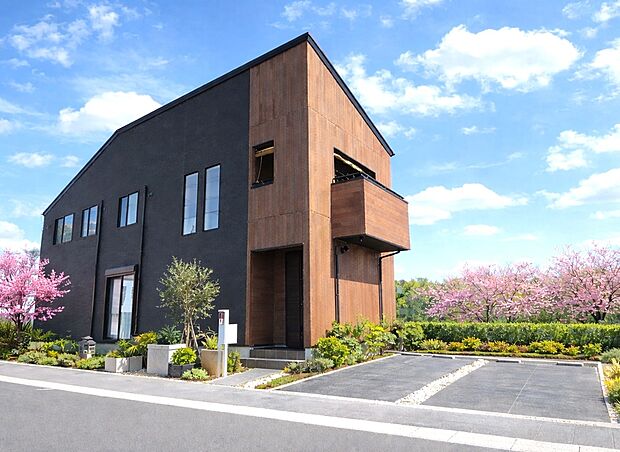 【外観施工例】ブラック外壁と木目のコントラスト、直線美が際立つ洗練モダン邸宅。