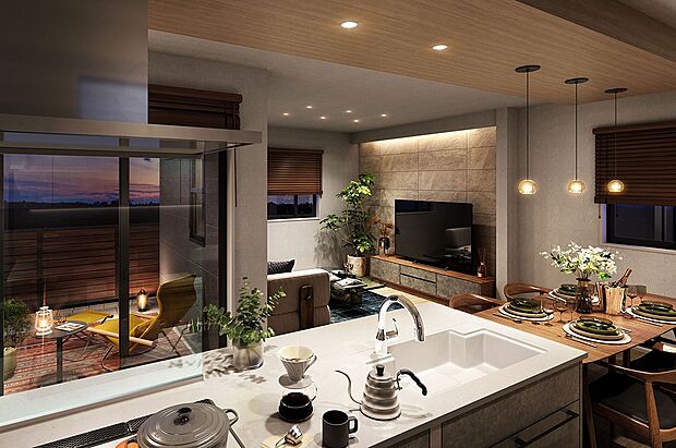 アイランド型のオープンキッチンを採用。キッチンからリビング、テラスへと視線が広がり、室内にいながら外の景色まで自然とつながりを感じられます。(1号棟 内観完成予想図)