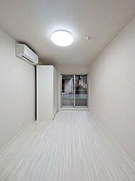 クオリアII 1階ワンルームのリビング/ダイニング