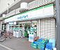 周辺：ファミリーマート紫明通店まで880m