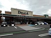 スーパー「デリシア豊野店まで2100m」