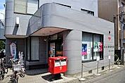 郵便局 稲田堤郵便局 393m