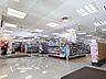 周辺：サンドラッグ亀有駅前店 160m
