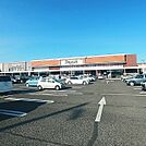 スーパー「デリシア庄内店まで875m」