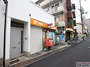 西成花園郵便局まで872ｍ