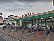ウシヒロ八熊店 徒歩12分。 920m