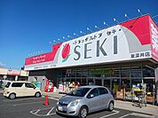 【ドラッグストア】ドラッグストアセキ東深井店まで269ｍ