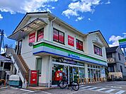 【コンビニエンスストア】ファミリーマート 向日洛西口店まで450ｍ