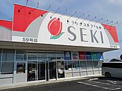 【ドラッグストア】ドラッグストアセキさくらの里まで1000ｍ